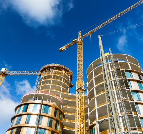 Pre-cast installations — crews and concrete elements on a building project